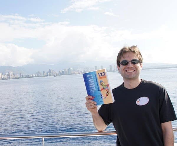 Sam Shankland with Chess Informant 123